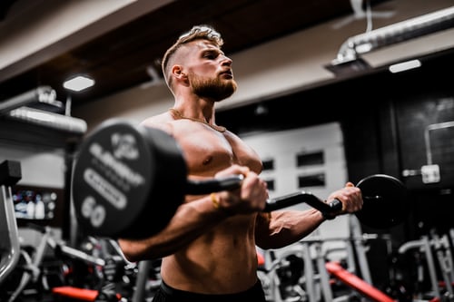 A man is exercising in a gym