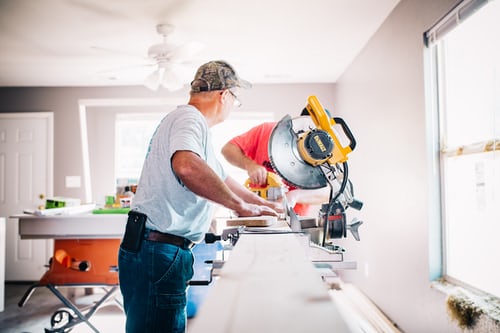 An old man is improving the house