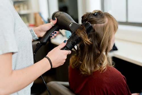 A customer is enjoying her hair spa